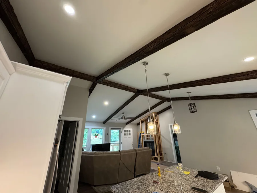 Beamed cathedral ceiling and new lighting in a whole-home remodel
