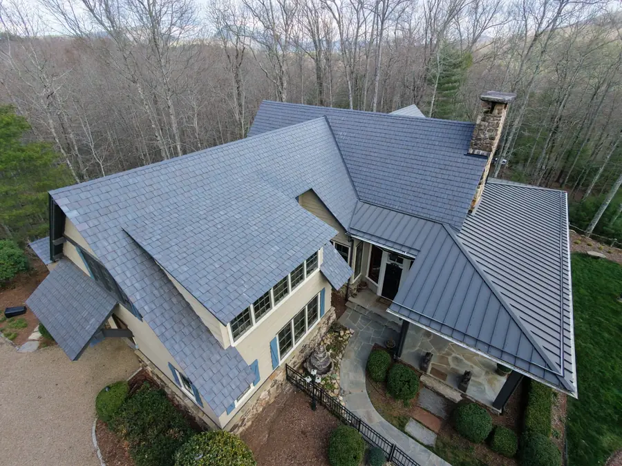 Synthetic slate roof with metal accents on a home in the Cashiers second-home market